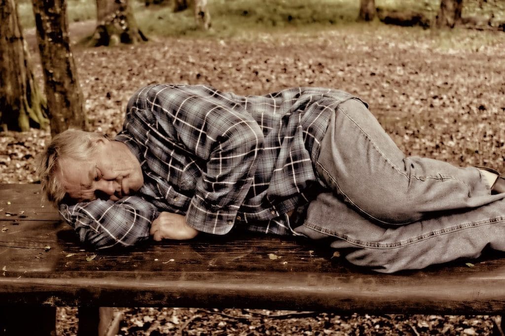 man sleeping in park