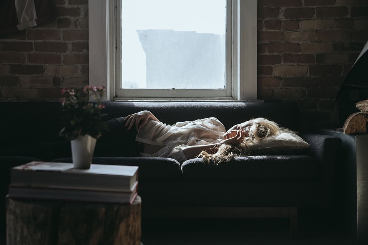 woman sleeping on a sofa